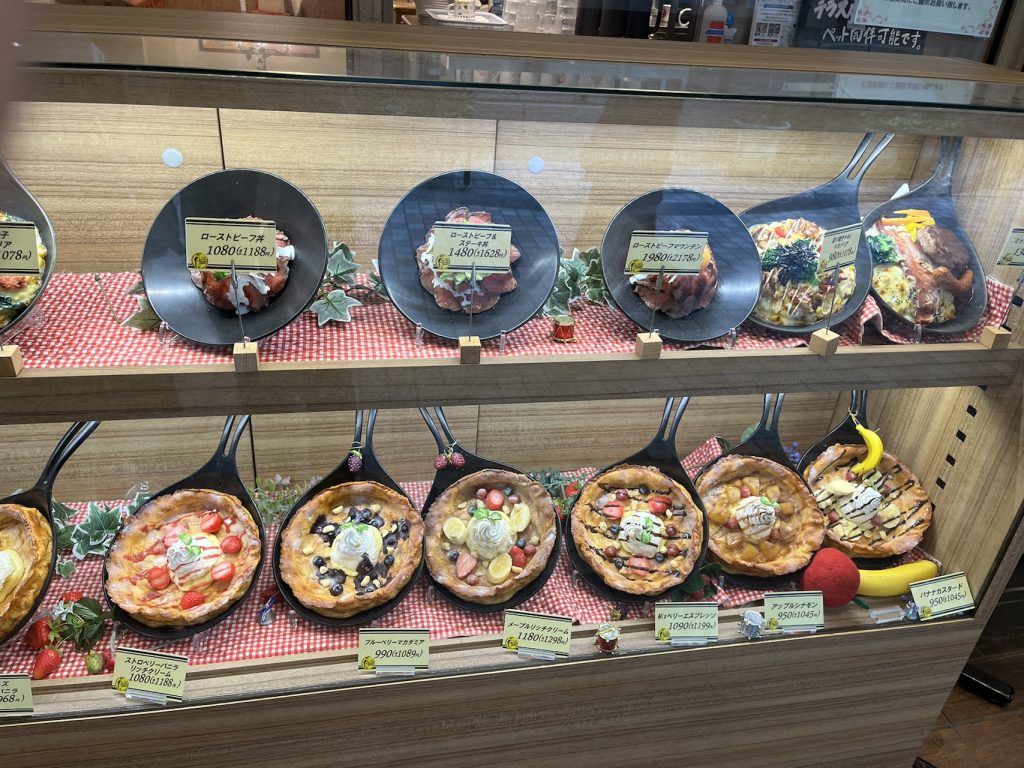 Plastic dish sample of a milky bread with toppings Plastic dishes in Japan showcasing the menu