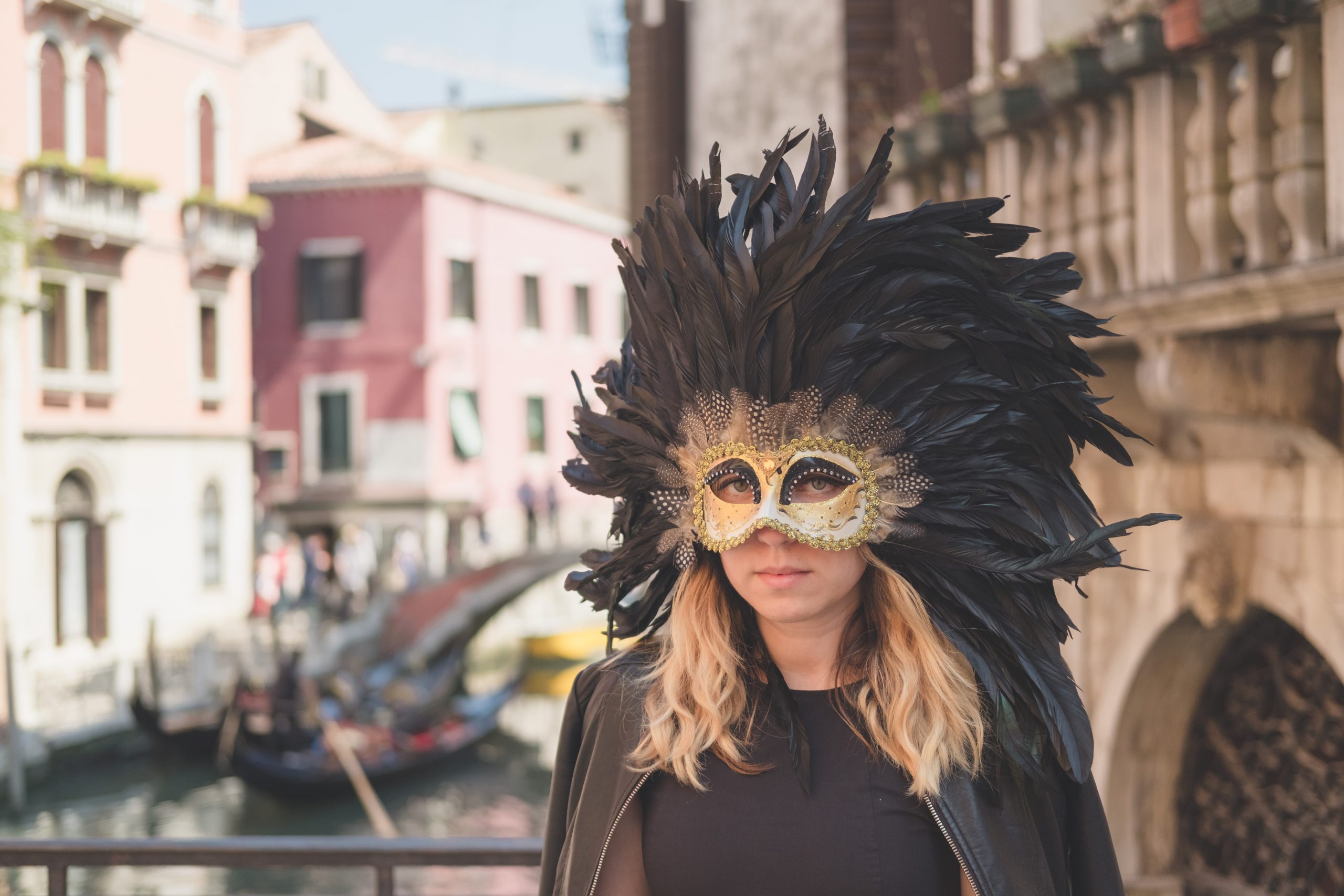 Cory from You Could Travel wearing a Venetian mask in Venice during her Porec to Venice day trip