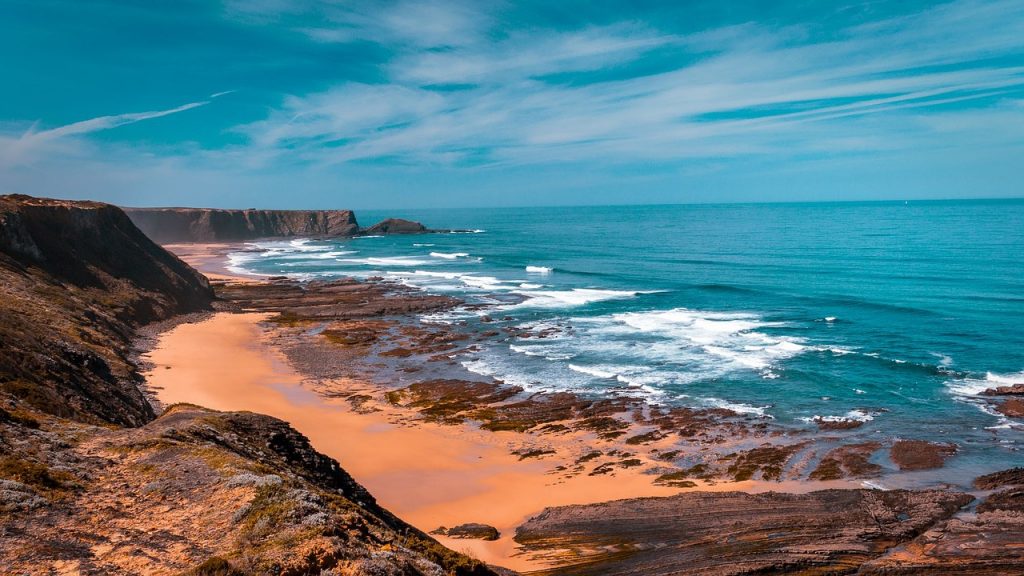 Beach in Portugal lined with beautiful cliffs