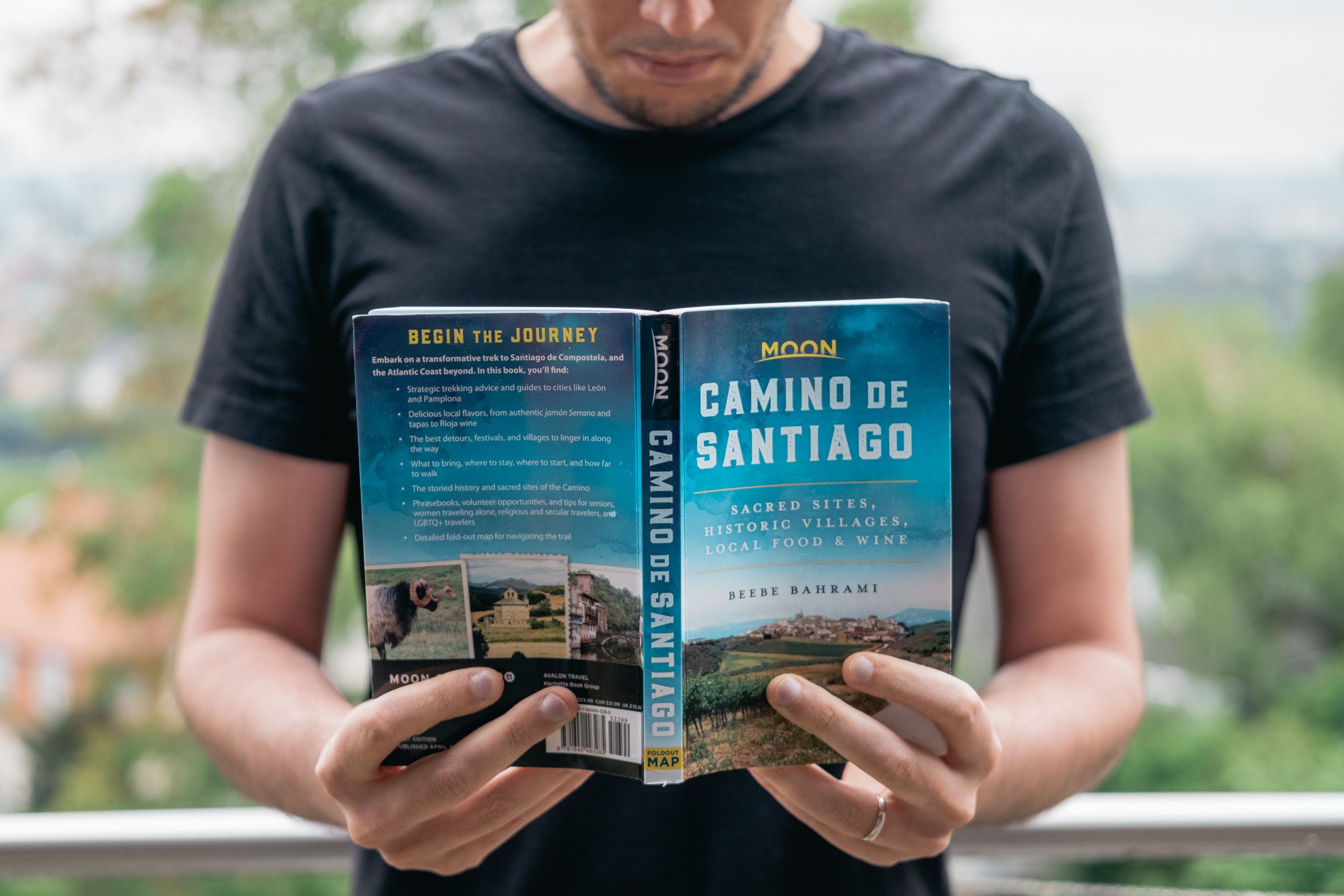 Reading our moon travel guide on Camino de Santiago