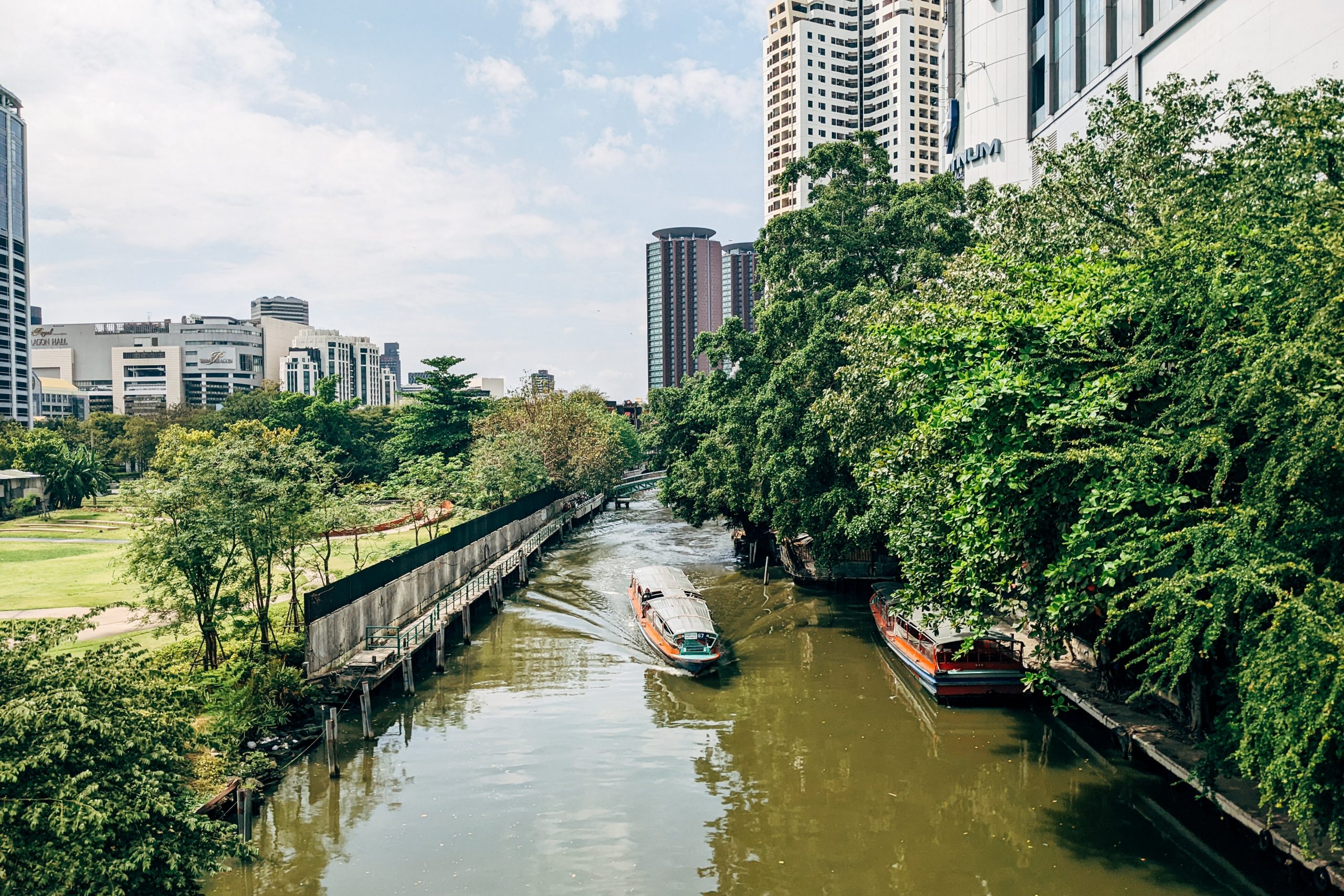 Riverside with its calming boats is a great place to stay in Bangkok for couples