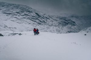 Cory and Greg from You Could Travel with their crew exploring a glacier in Norway during their grand road trip