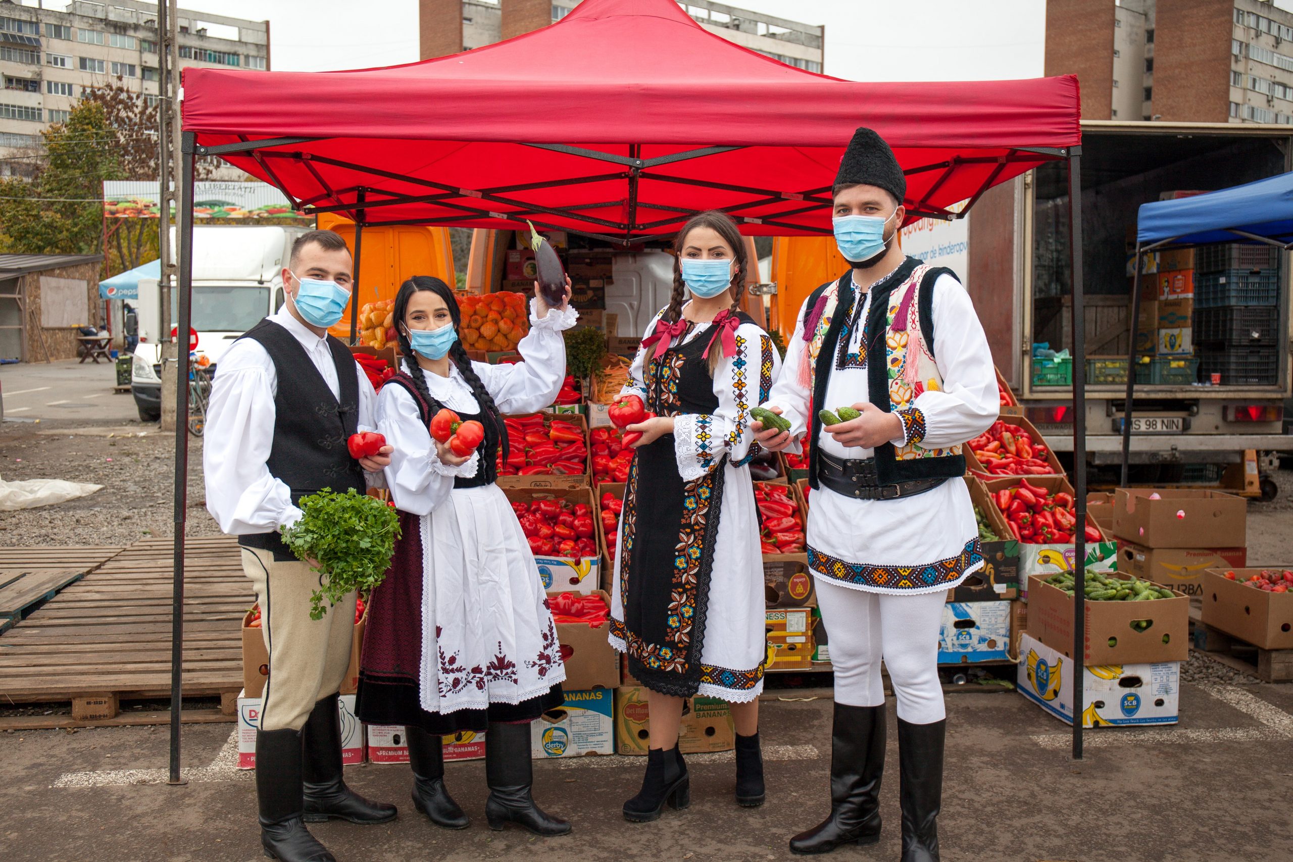 Romanians in traditional Romanian clothes wearing masks