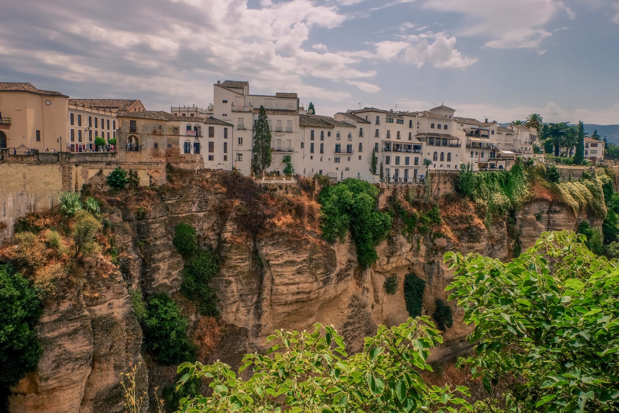 The view of Spanish houses located on the steep slopes of Ronda