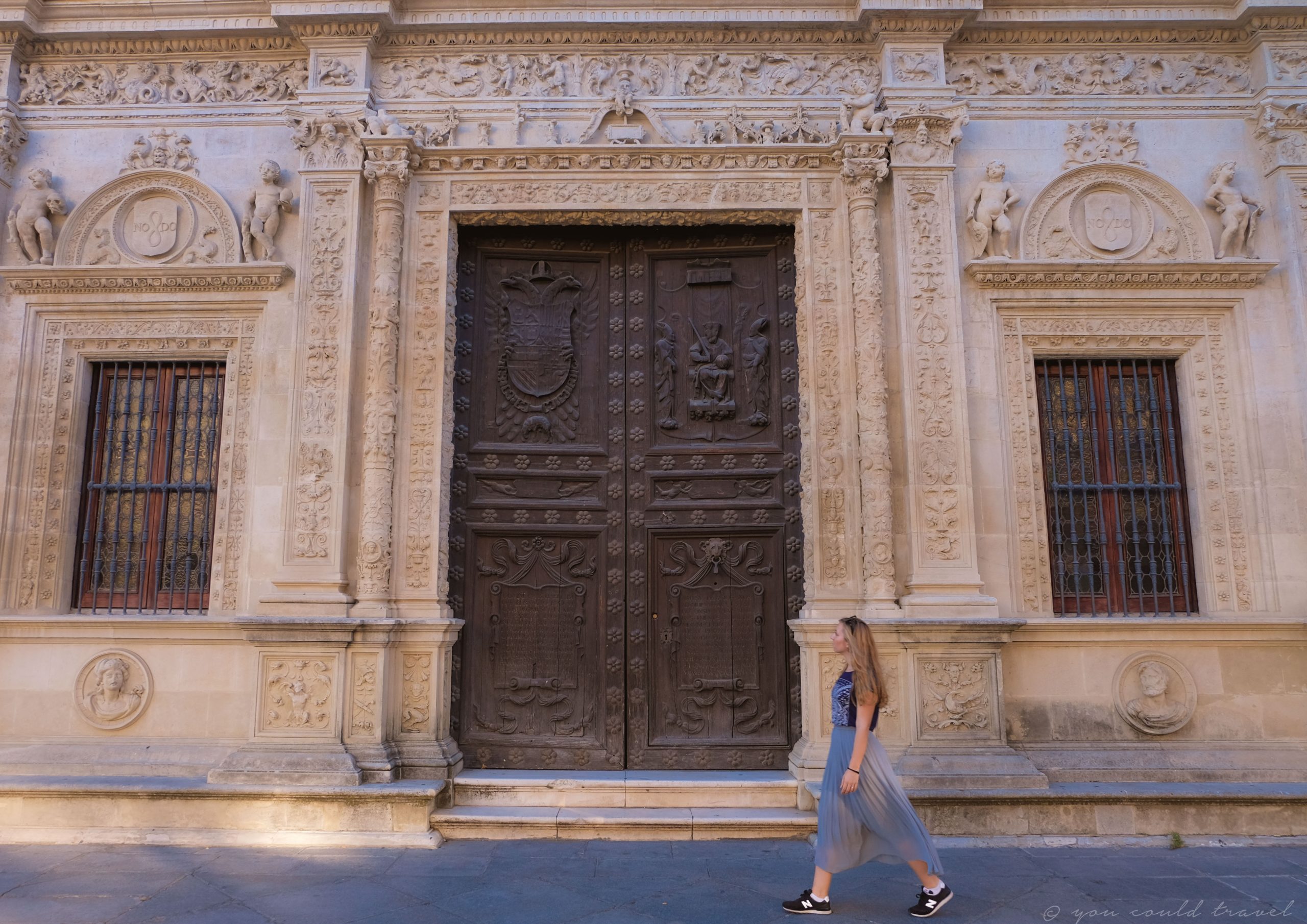 Cory walking in Seville and passing a gorgeous historical door