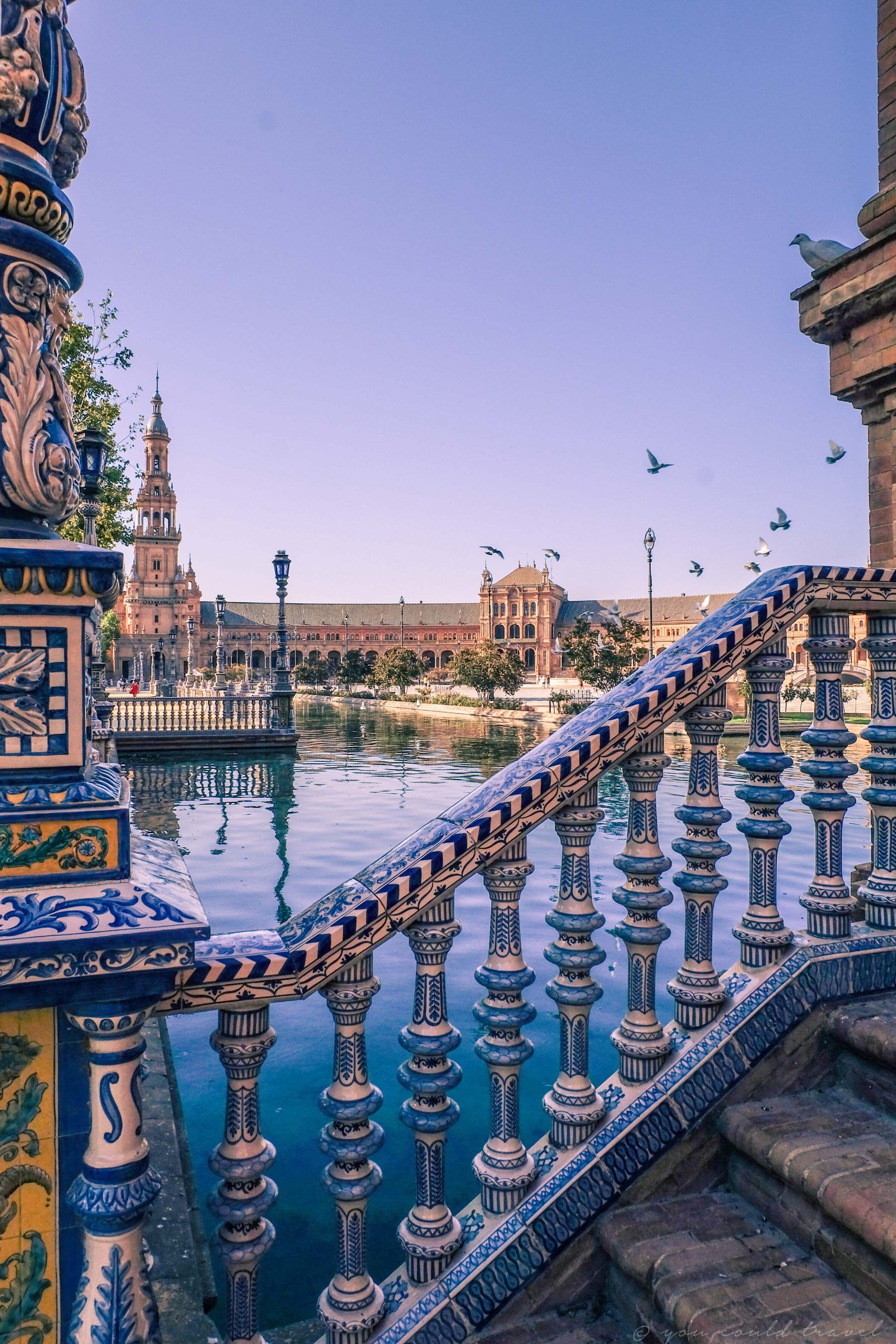 The beautiful Plaza de Espana in Seville with its water and colourful rails
