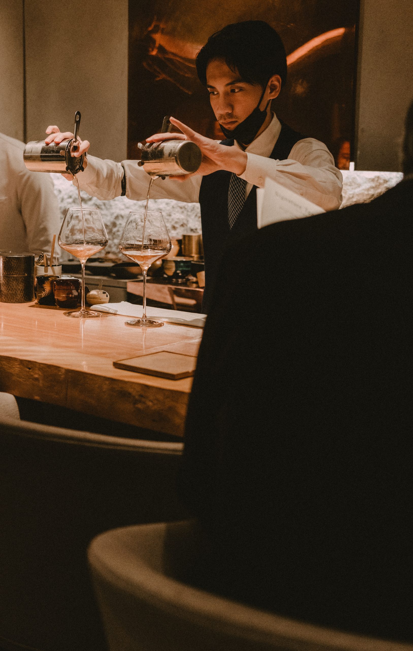 Skilled bartender creating Japanese tea cocktails at Mixology Salon Japan