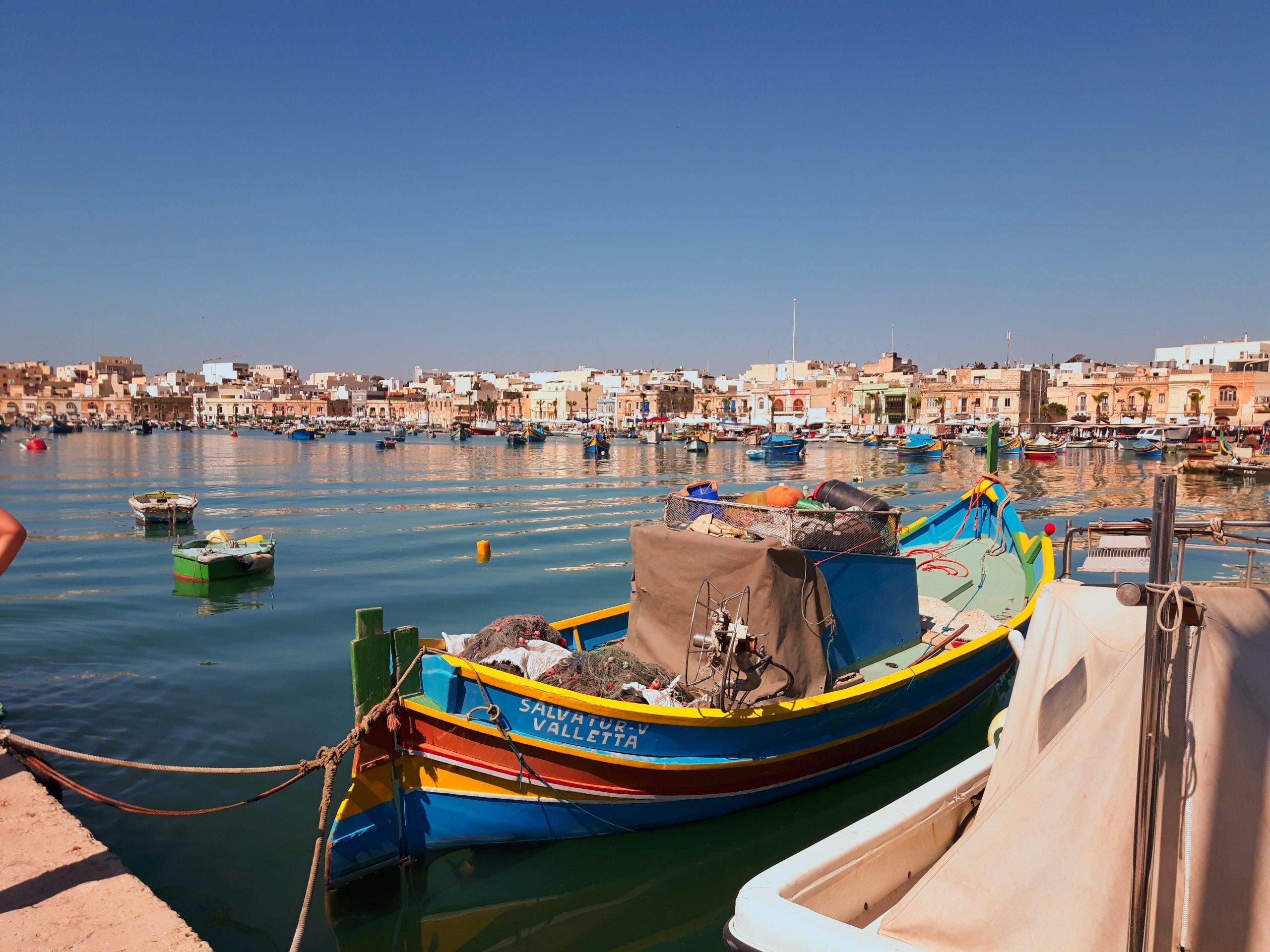 Beautiful boats in the bay of Malta - St Paul's Bay is a great place to stay in Malta