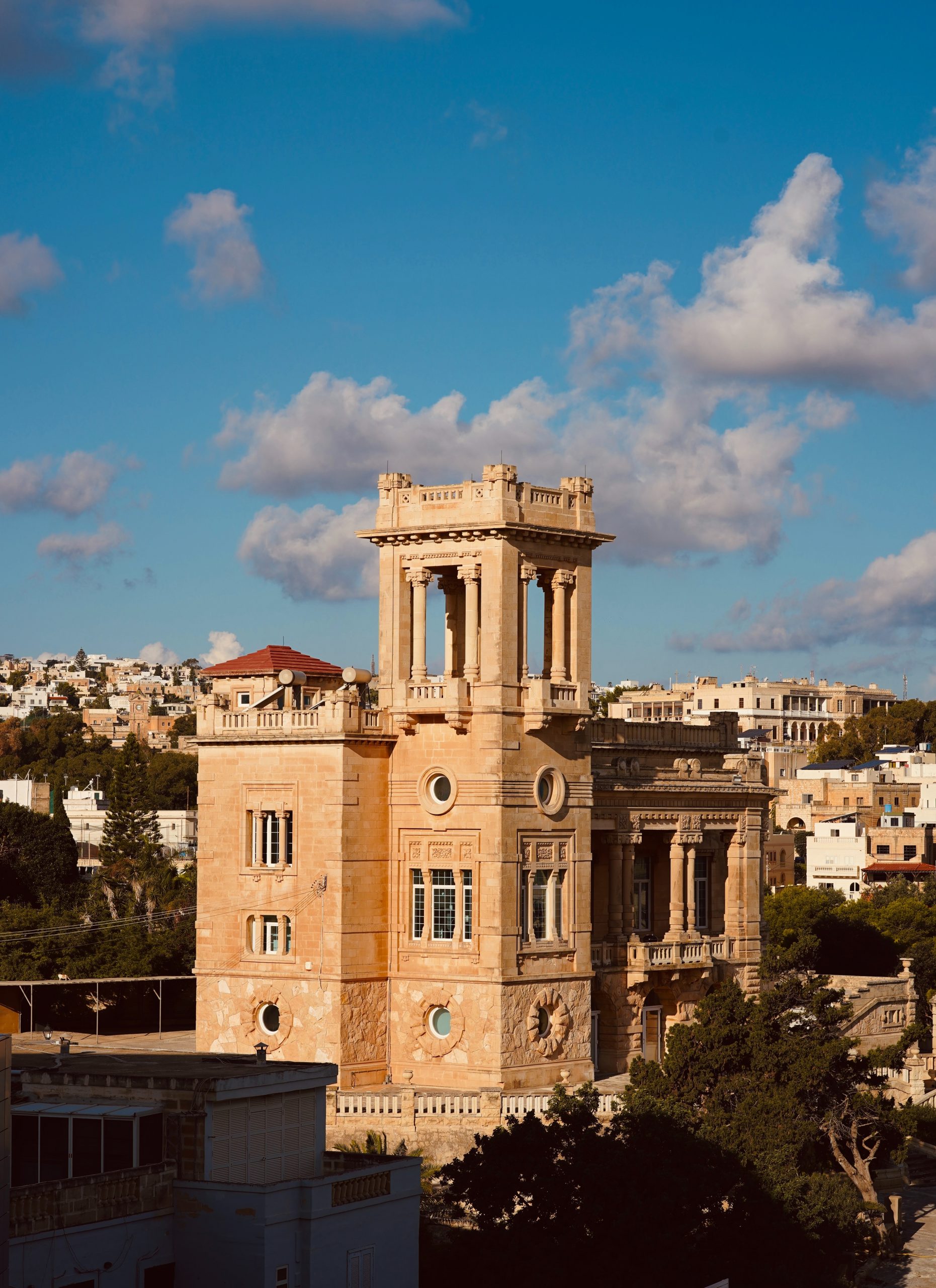 St Julian's Bay with its beautiful architecture and tower is a great place to stay in Malta