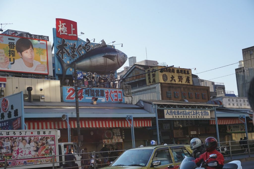 Tsukiji Outer Market recognizable mascots on top of shops 