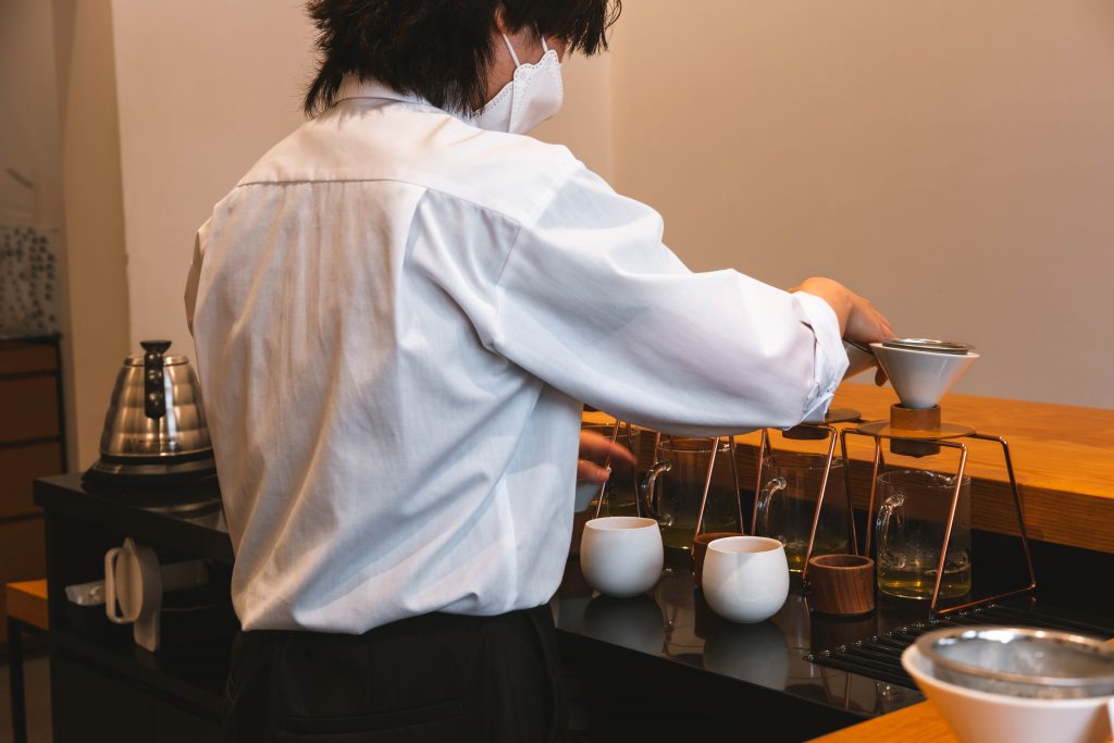 The barista preparing the hand dripped green tea at Tokyo Sarto
