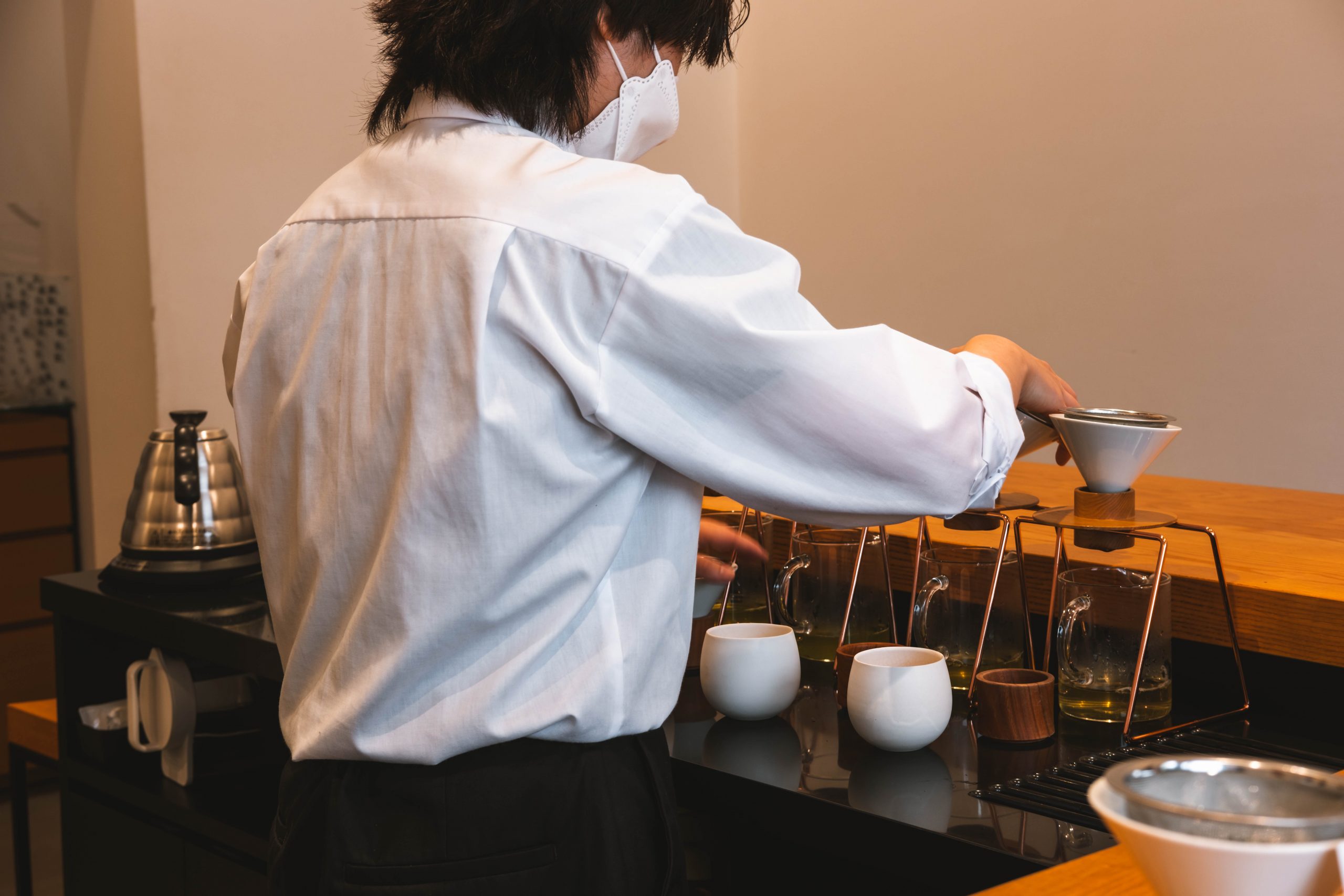 The barista preparing the hand dripped green tea at Tokyo Sanryo