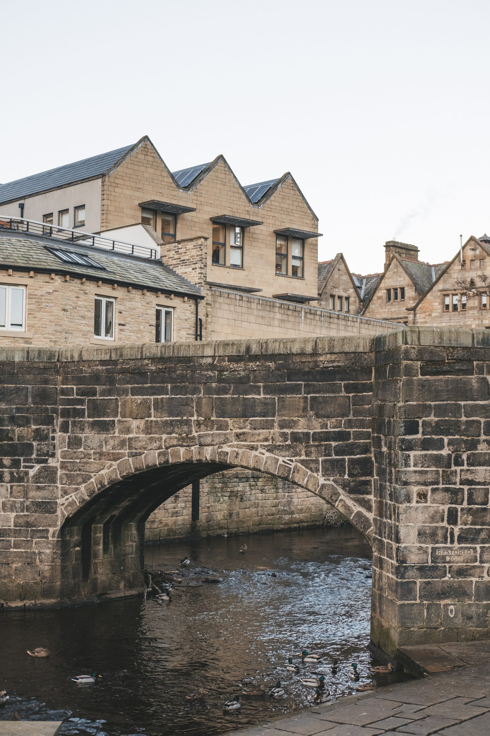The gorgeous canals under the old stone bridge in Hebden Bridge The gorgeous canals under the old stone bridge in Hebden Bridge