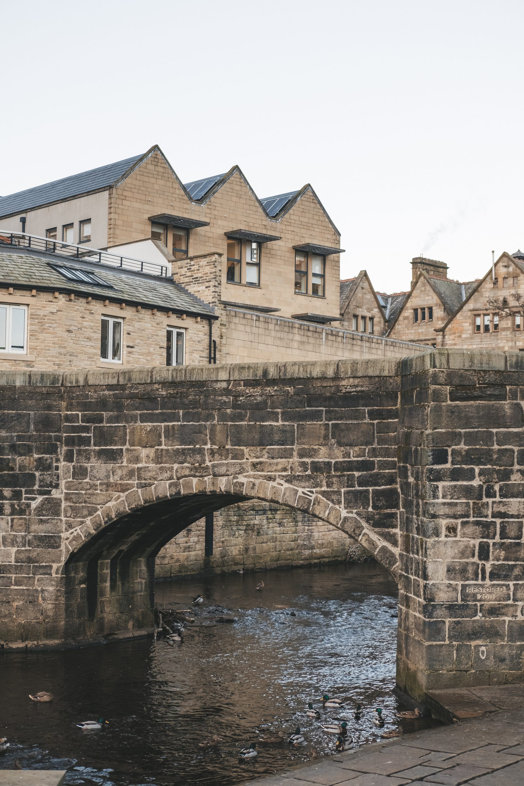 The gorgeous canals under the old stone bridge in Hebden Bridge