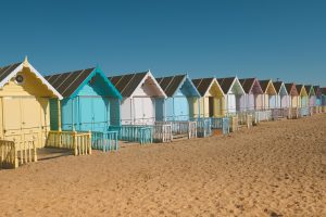 Things to do in Essex visit Mersea island with its colourful huts
