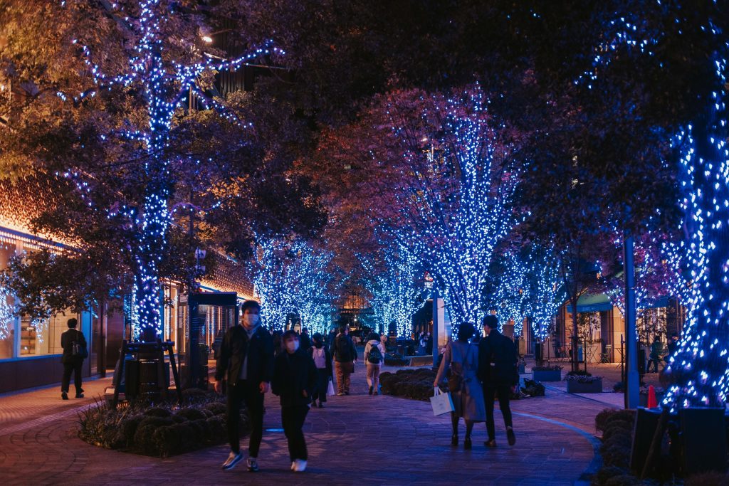 People walking around Tokyo Midtown during the Christmas illuminations