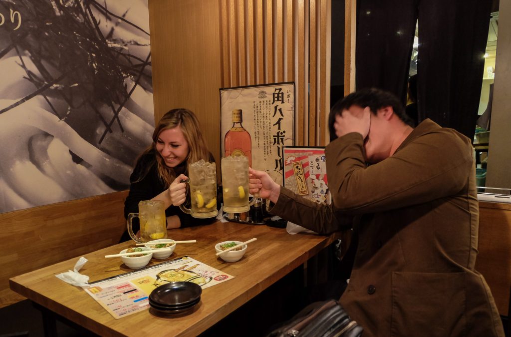 Cory and her friend Kota, drinking on a Tokyo pub crawl and discussing everything Japan together
