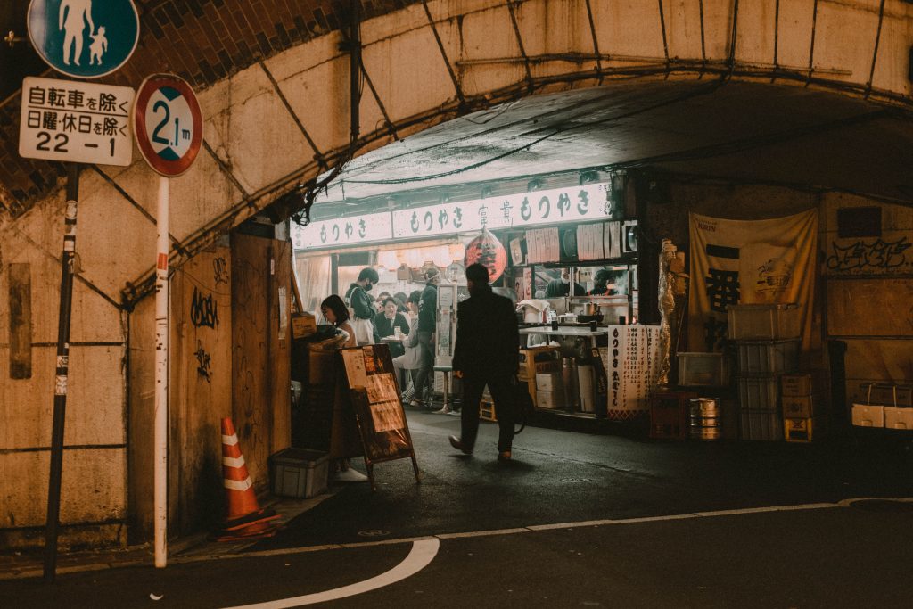 Salaryman entering a Yokocho in Tokyo at night