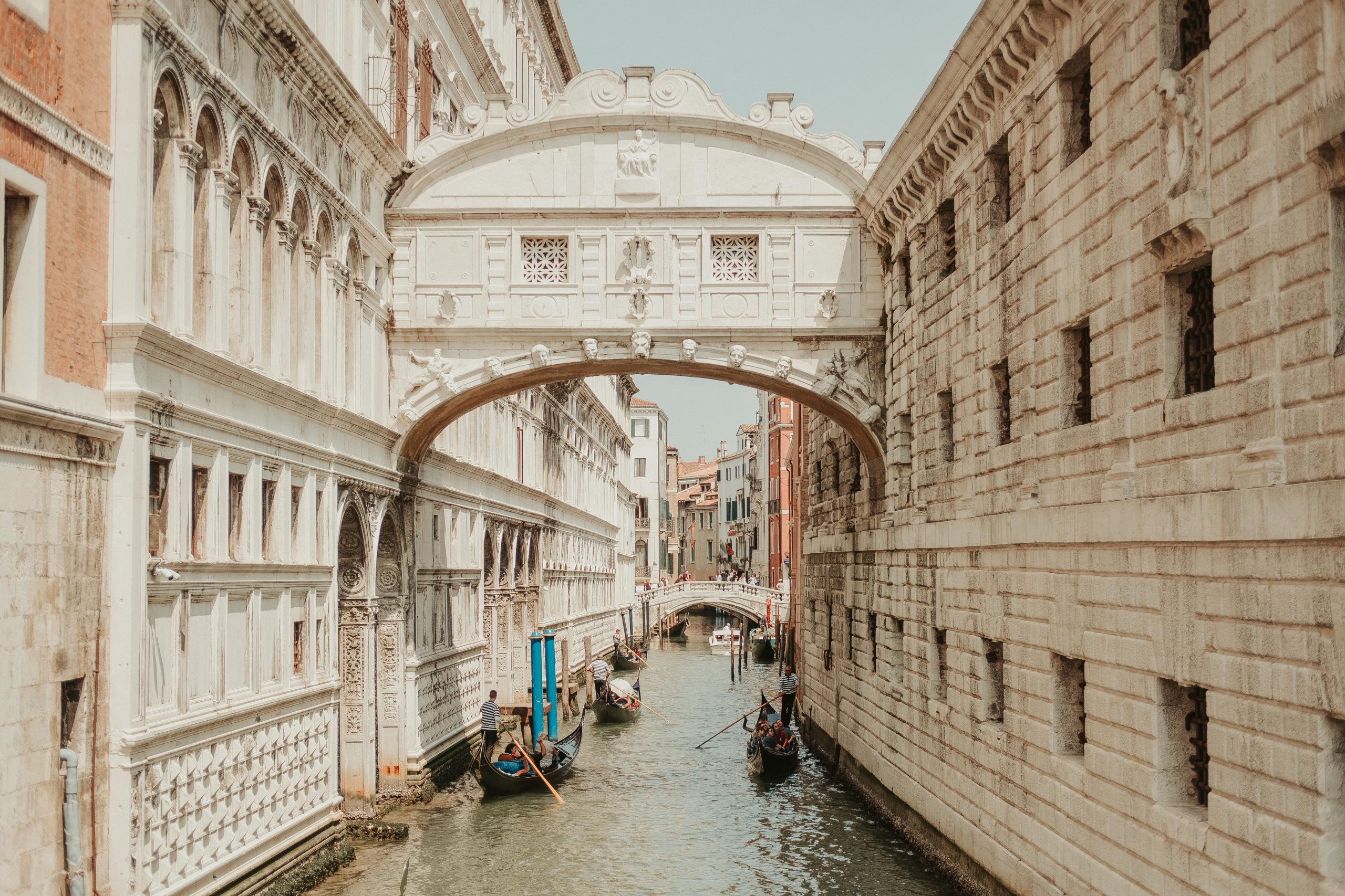 Stunning Venetian canal with Gondoliers along the waters