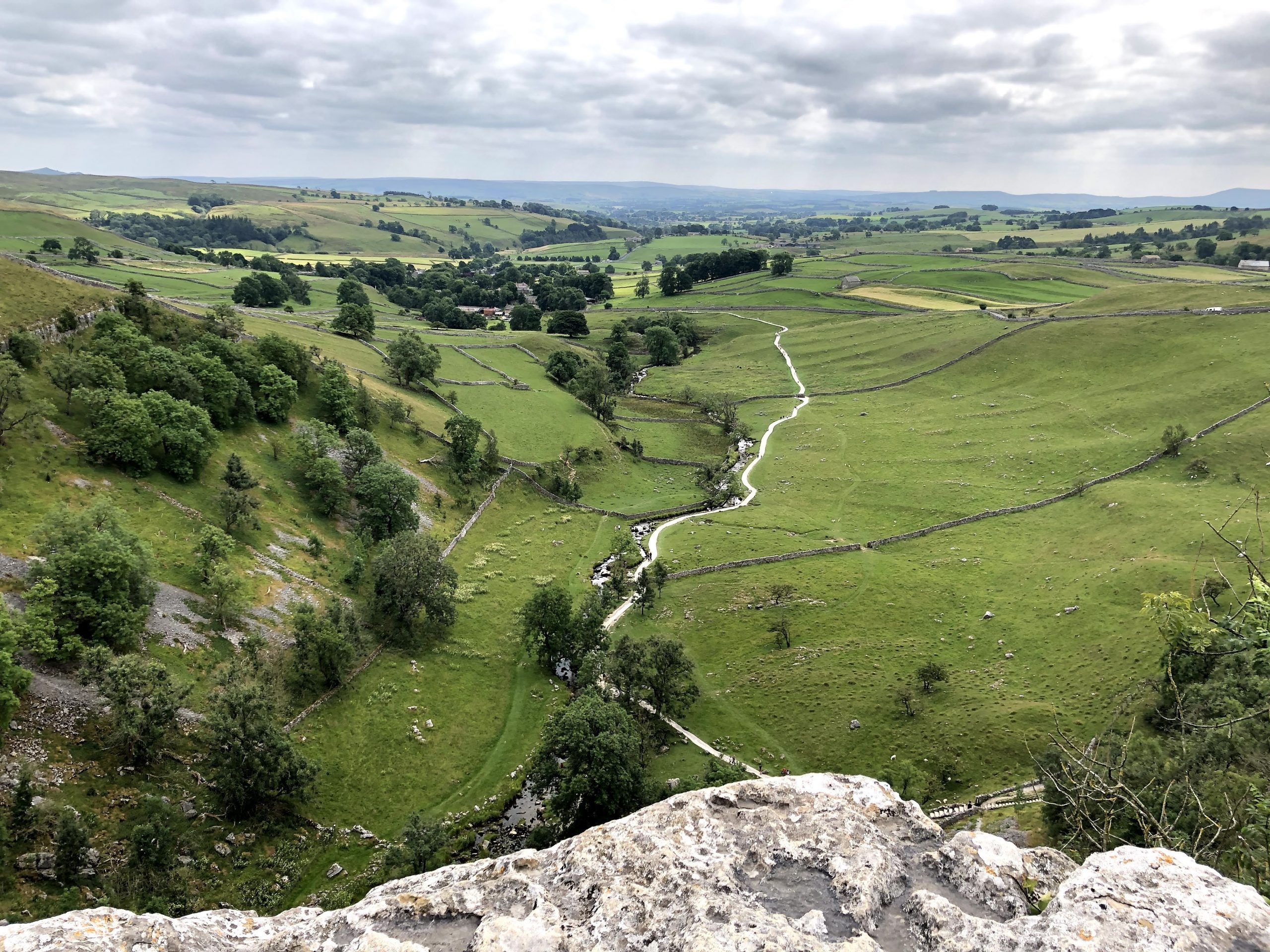 The view across the valley from Malham cove cliff
