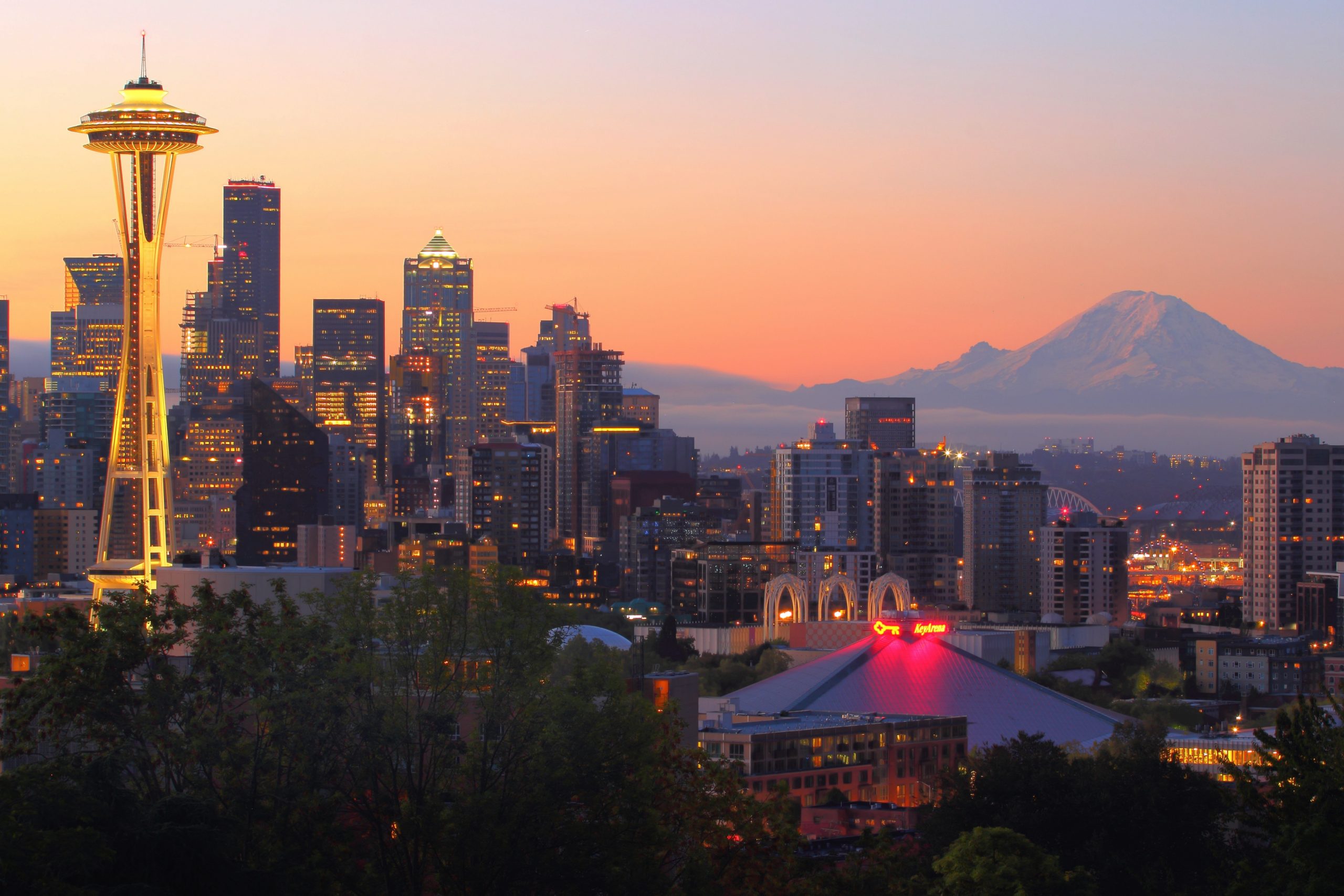 Where to stay in Seattle - the city scape at twilight with the famous needle