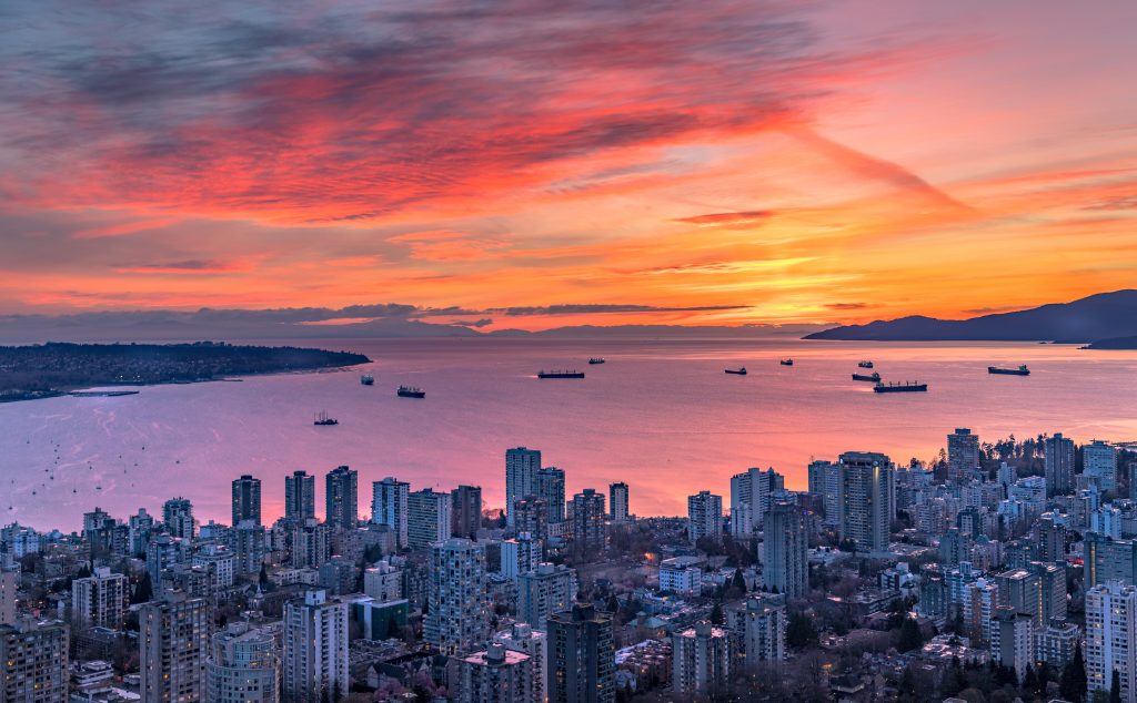 Where to stay in Vancouver - an epic sunset over the city from a tall point