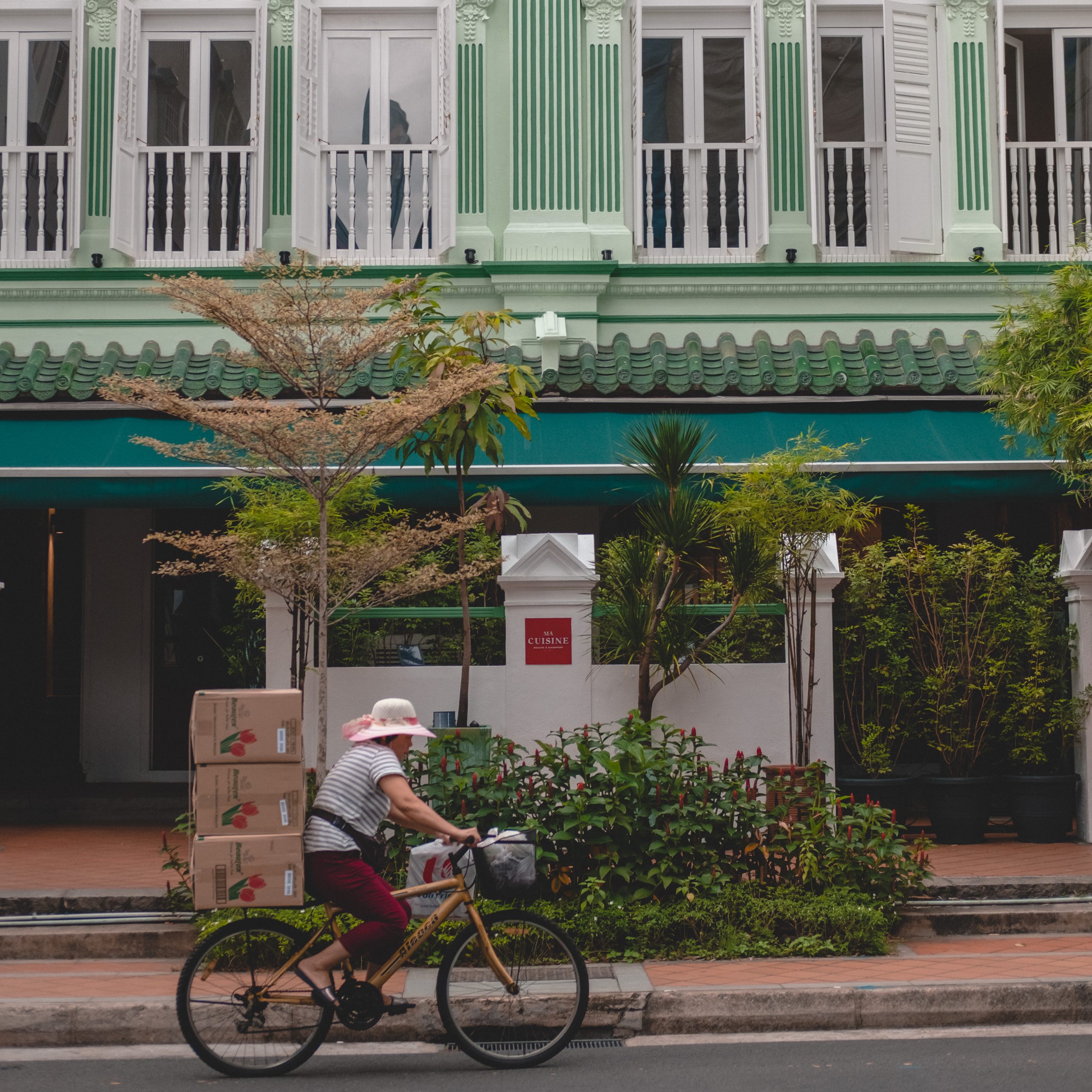 Woman on bike discovering Singapore itinerary